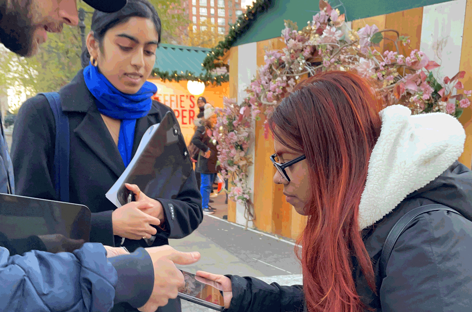 interaction with subway rider filling out survey